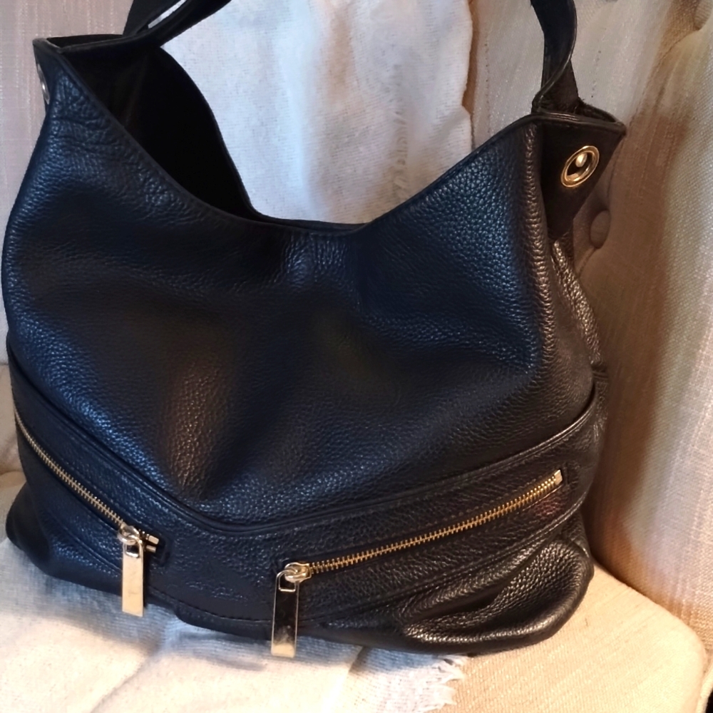 Michael Kors black leather bag. Missing gold hardware strap.